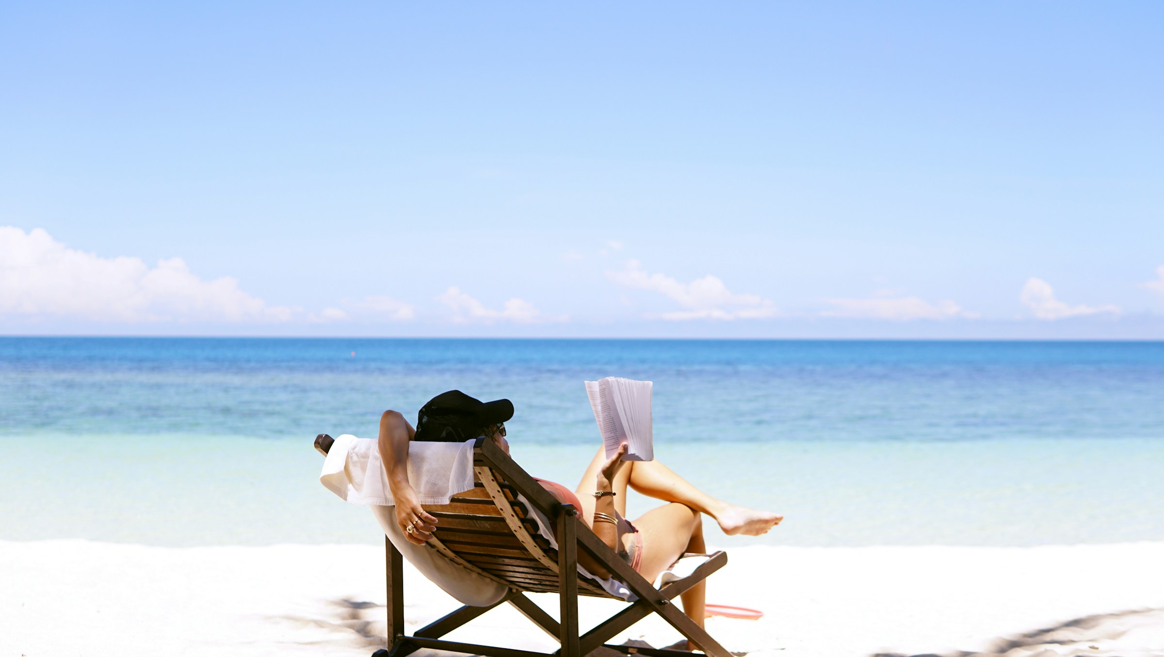 Woman at the beach reading